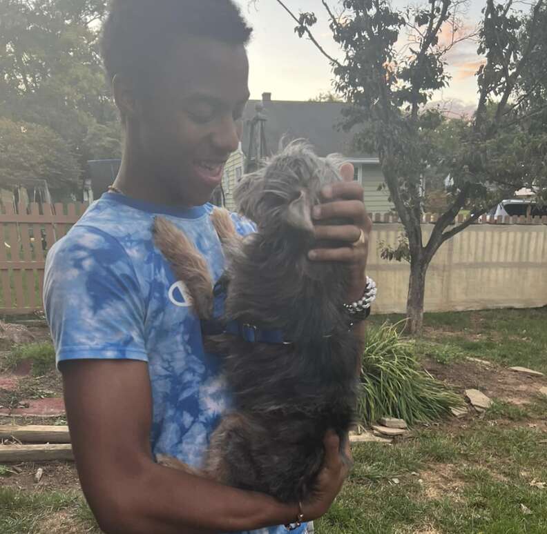 man holding dog