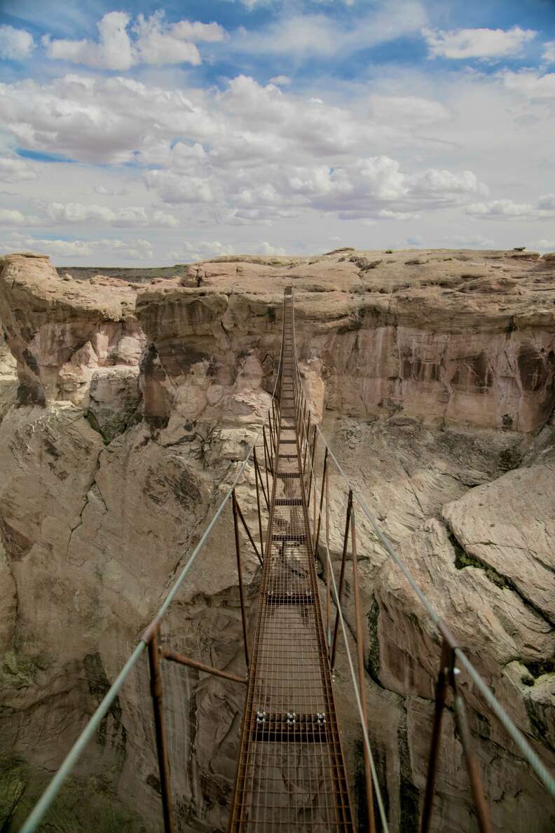 bridge made of iron between rocks