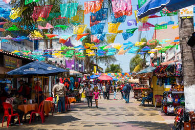 colorful hanging flags at Plaza Santa Cecilia
