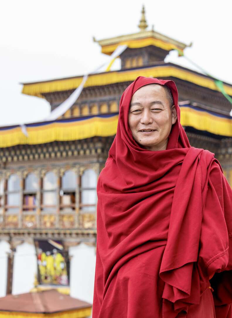 monk in front of temple