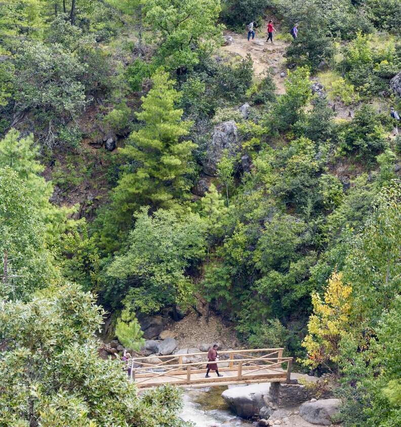 person crossing bridge