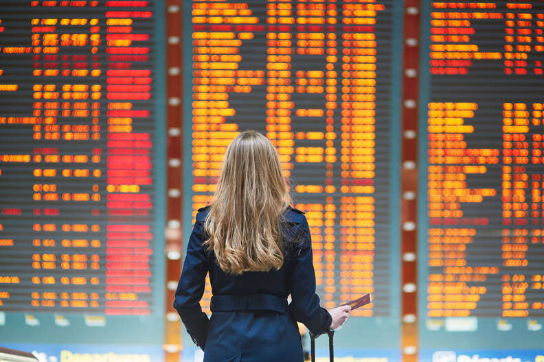 lady looking at a flight schedule