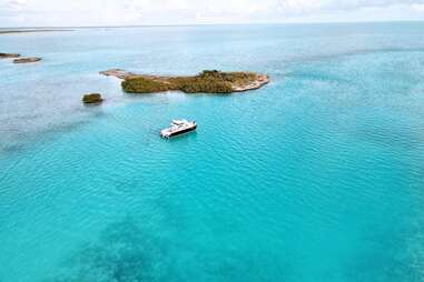 aerial view of scuba diving boat in turquoise waters 