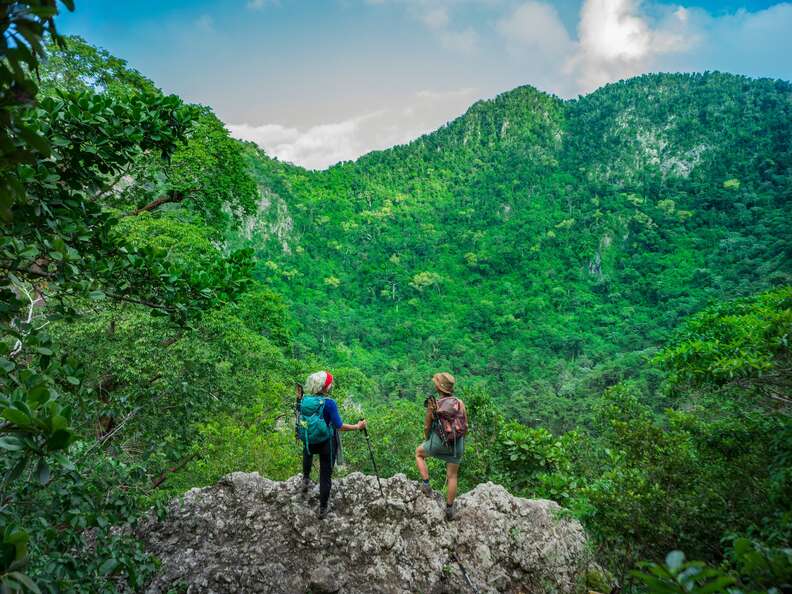 hikers looking over crater