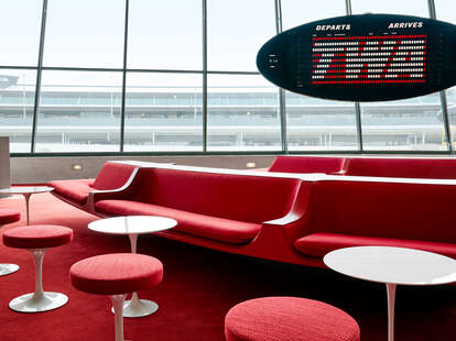 The Sunken Lounge at the TWA Hotel boasts a split flap departures board by Solari di Udine — and a view of the hotel’s restored 1958 Lockheed Constellation “Connie.