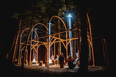 people sitting around fire