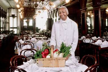 Edna Lewis stands in the dining room of the Gage & Tollner restaurant