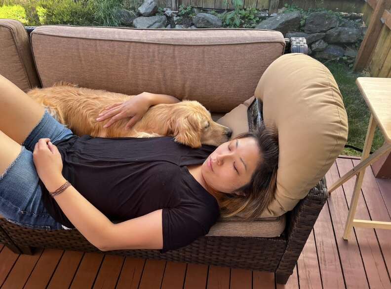woman and dog sleeping 