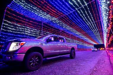 Truck Driving Through Magic of Lights