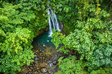 waterfall going into swimming hole