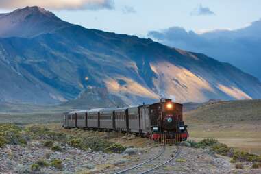 train with mountains in backround