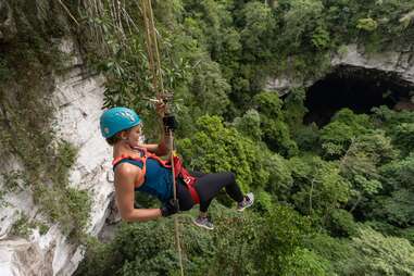 person rockclimbing