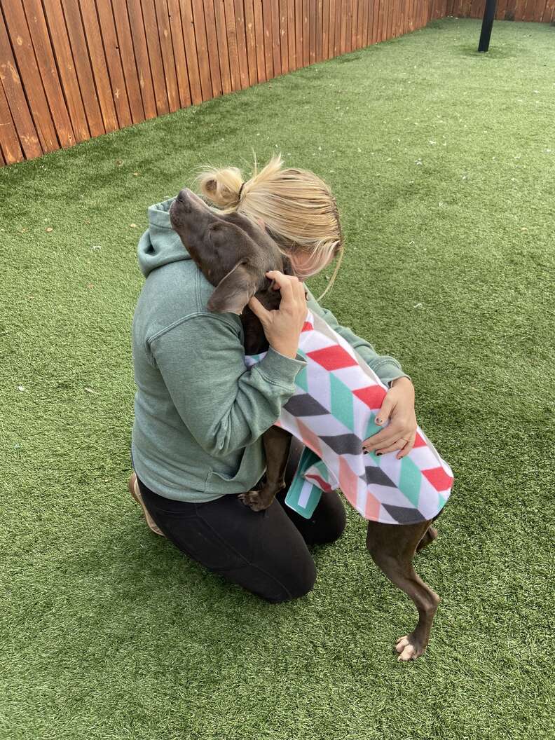 Stray Dog Found Sleeping On Trash Can't Stop Hugging Her Rescuers - The Dodo