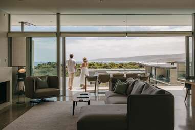 people looking at view from hotel room