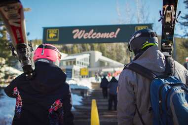 skiers entering lodge at ski santa fe