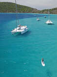 snorkeling in a beautiful bay surrounded by boats