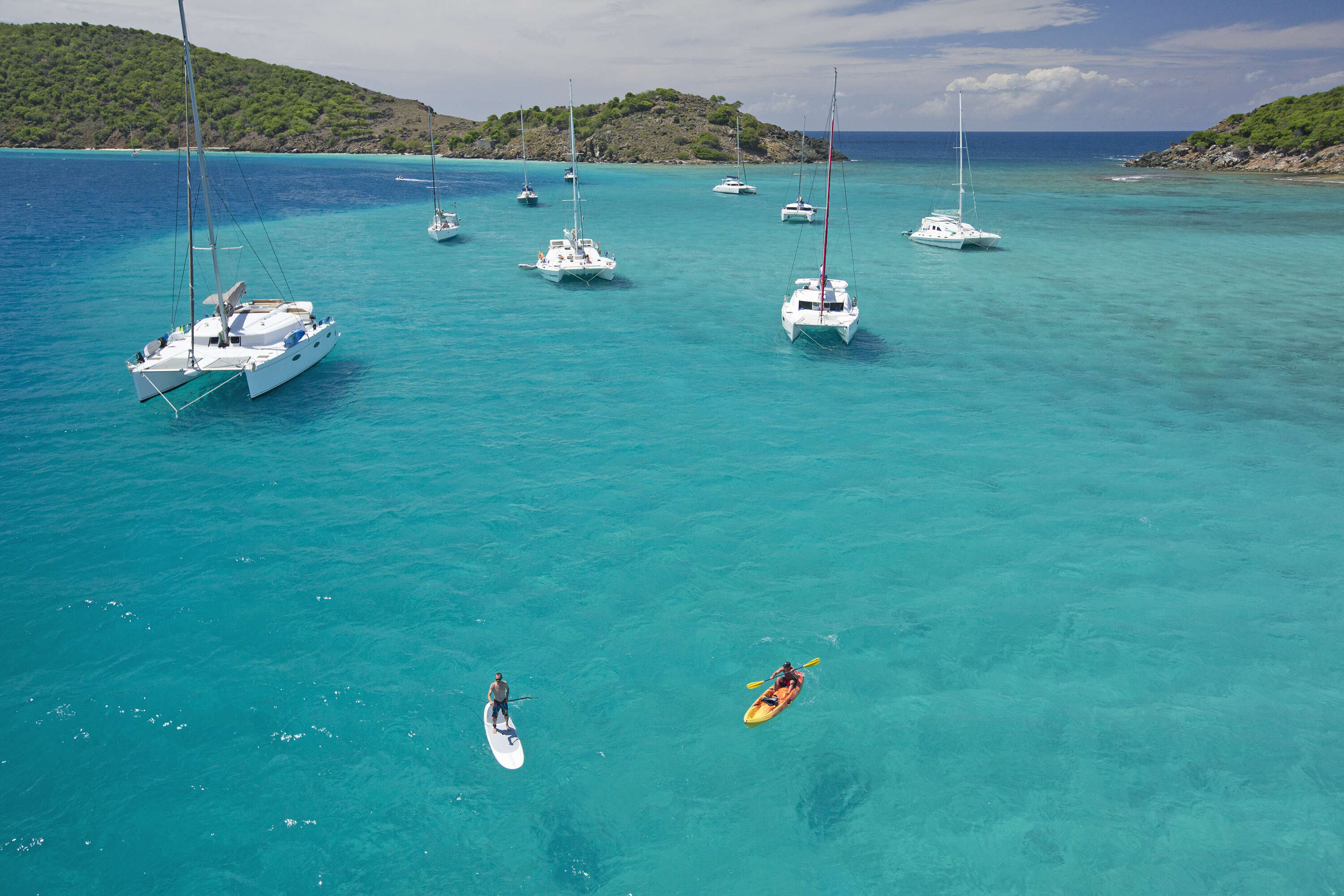 snorkeling in a beautiful bay surrounded by boats