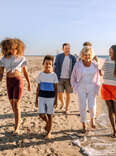 Family walking on beach