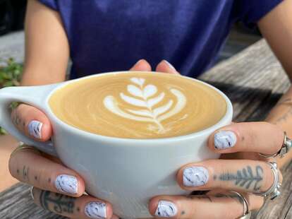 Person Holding Drink