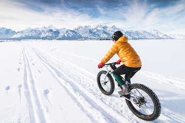 Fat biking with mountain backdrop