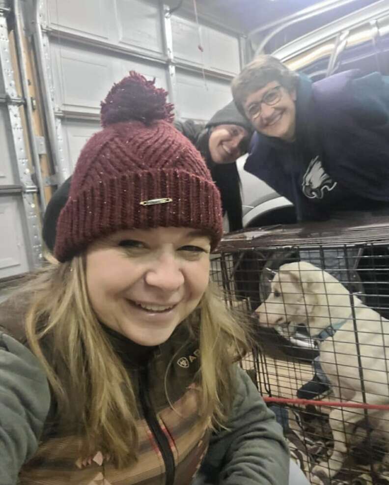 woman and dog in cage