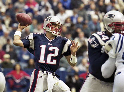 New England Patriots quarterback Tom Brady (12) watches a replay