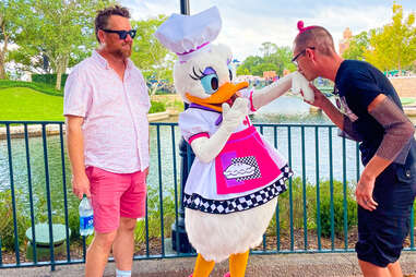 Two men with Daisy Duck