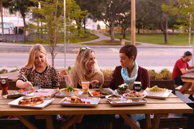 People Dining at Sistrunk Marketplace & Brewery