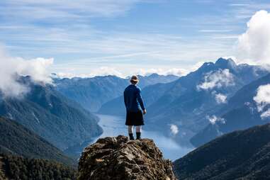 Hiker on cliff in Fiordland National Park
