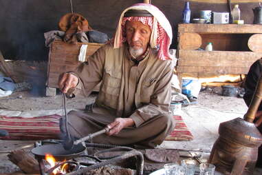 Bedouin man making coffee