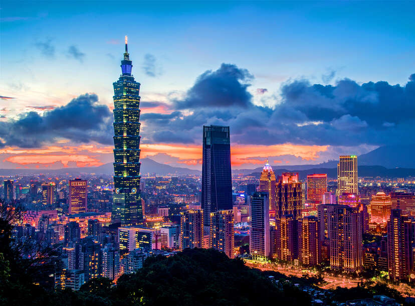 Taipei 101 is a landmark and the tallest building in Taiwan, shown at sunset