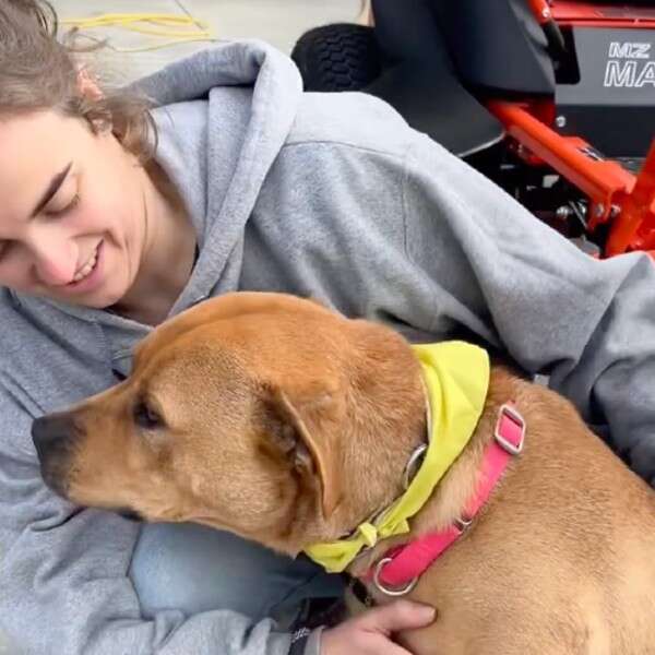 woman hugging dog