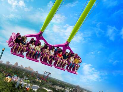 Young people riding in a 10-person gondola 135 feet in the air on the new Serengeti Flyer at Busch Gardens. 