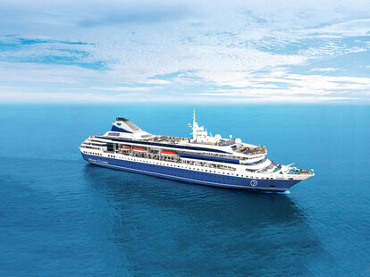 A Miray cruise ship over blue open water
