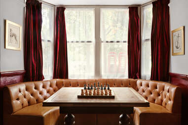 A chess game at a booth inside of the pub.