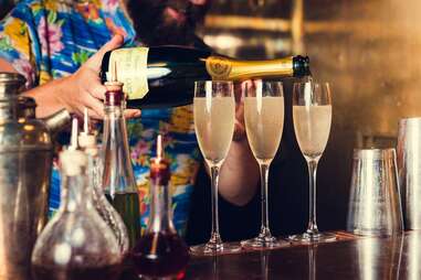 bartender pouring champagne