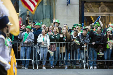 A crowd lines the street for the St. Patrick's Day Parade in New York City