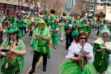 A band dressed in eclectic green costumes plays while marching in the St. Patrick's parade down Peachtree Street, on March 15, 2014 in Atlanta, GA