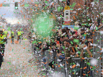 Confetti flies after Gov. Charlie Baker and Boston Mayor Michelle Wu cut the opening ribbon to start Bostons St. Patricks Day Parade in South Boston on March 20, 2022.