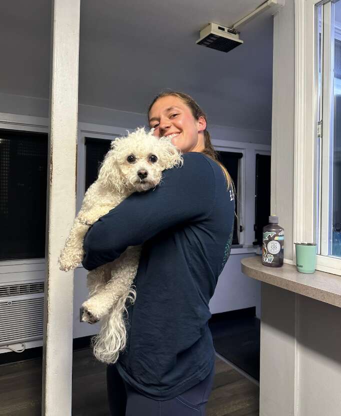 girl holding dog 