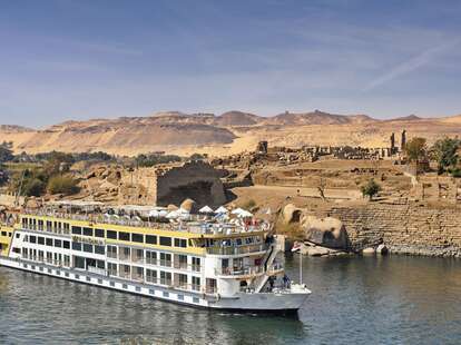 An AmaWaterways cruise ship travels along the Nile River