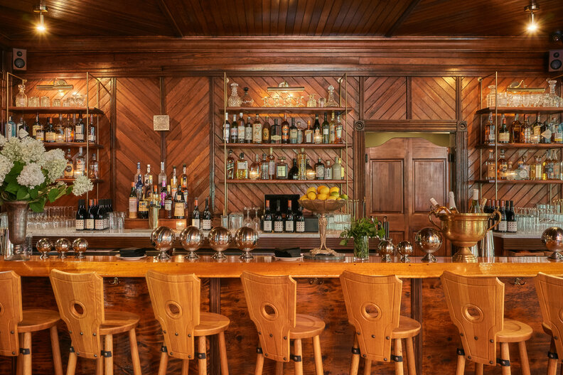 The wood-paneled bar inside the Hotel Lilien boutique hotel in the Catskills