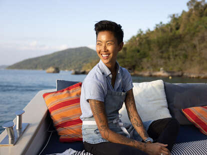 chef kristen kish posing at a floating restaurant in paraty, brazil