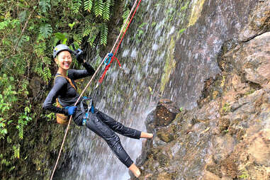 kristin kish rappeling down a waterfall in boquete, panama