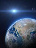 An asteroid passing above Earth in Space. 