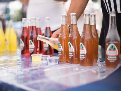 Jarritos soda samples being poured