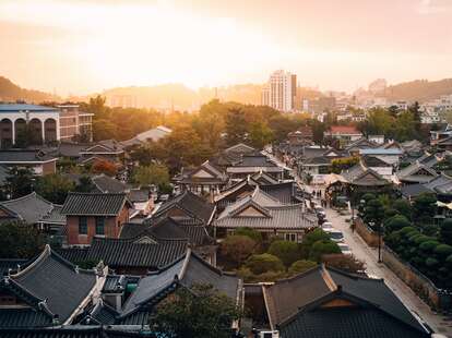 An aerial view of the Hanok Village in Korea, as the sun sets.