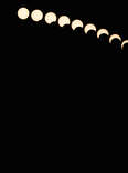Multiple exposure photo of the various phases of the sun during a solar eclipse