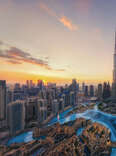 An aerial view of the Burj Khalifa in Dubai at sun set. 