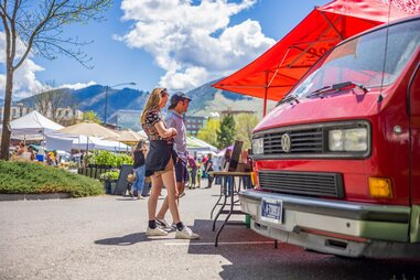 friends shopping at a farmers market